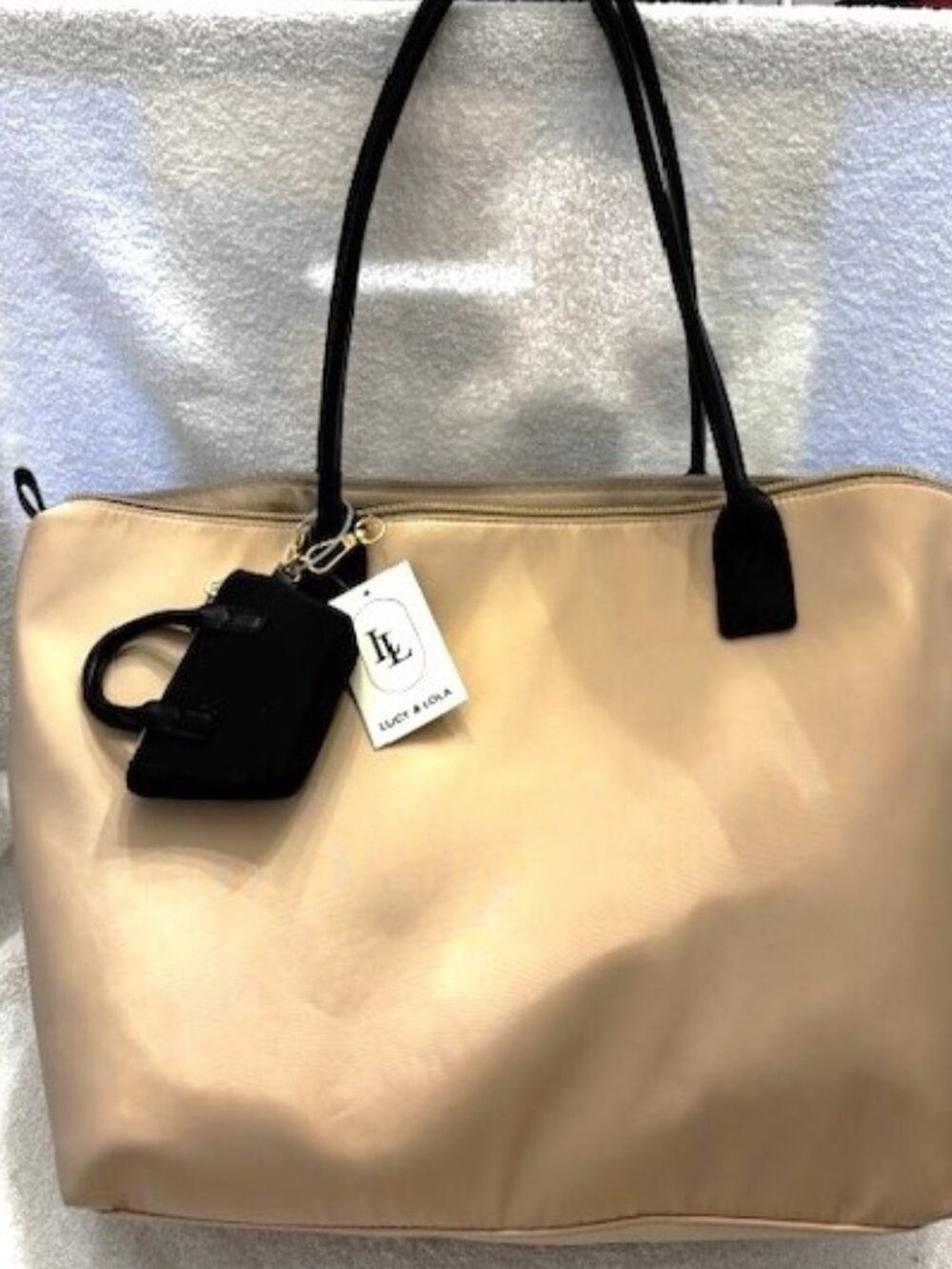 Lucy & Lola oversized light tan nylon zip close tote with black handles NWT